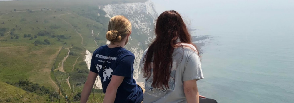 Girls overlooking cliff
